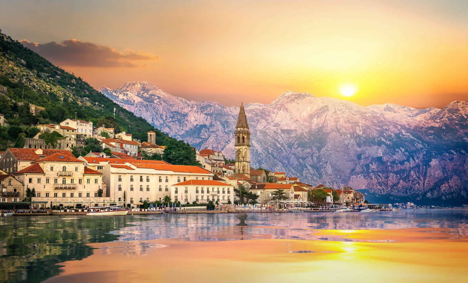 Historic city of Perast in the Bay of Kotor in summer at sunset